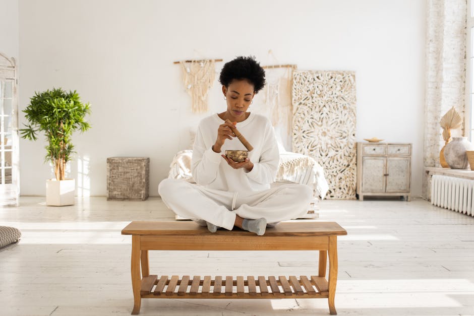 A person practicing mindful meditation in a serene natural setting, representing the harmonious balance Titoluu helps you achieve